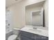 Bathroom featuring a gray vanity with quartz countertop and a shower-tub combo at 104 Ciara Pl # B, Mooresville, NC 28117