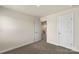 Bedroom featuring carpeted floors and neutral paint with an open door to the home's hallway at 104 Ciara Pl # B, Mooresville, NC 28117