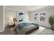A bedroom with soft natural light and contemporary decor showcasing an inviting and relaxing space at 104 Ciara Pl # B, Mooresville, NC 28117