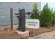 Crossrail Station community sign with manicured landscaping, offering a welcoming entrance and neighborhood charm at 104 Ciara Pl # B, Mooresville, NC 28117