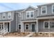 Charming townhome exterior with classic brick accents and a welcoming front porch at 104 Ciara Pl # B, Mooresville, NC 28117