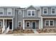 Charming townhome featuring a covered entrance, landscaped front yard, and appealing architectural details for a cozy curb appeal at 104 Ciara Pl # B, Mooresville, NC 28117