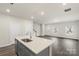 Contemporary kitchen featuring a large island with sink and stainless steel appliances at 104 Ciara Pl # B, Mooresville, NC 28117