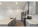 Well-appointed kitchen featuring gray cabinets, stainless appliances, and a central island at 104 Ciara Pl # B, Mooresville, NC 28117