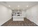 Modern kitchen with a central island, stainless steel appliances, and ample cabinet space at 104 Ciara Pl # B, Mooresville, NC 28117