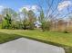 View of the expansive backyard with a concrete patio, perfect for outdoor entertaining at 1102 Balcorn Pl, Charlotte, NC 28214
