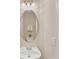 Cozy bathroom features a round mirror, vanity, and essential fixtures for comfortable living at 1102 Balcorn Pl, Charlotte, NC 28214