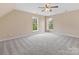 Large bedroom featuring two windows allowing for natural light and a ceiling fan at 1102 Balcorn Pl, Charlotte, NC 28214