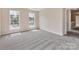 Empty bedroom with neutral walls, plush gray carpet and lots of natural light at 1102 Balcorn Pl, Charlotte, NC 28214