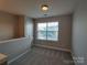 Comfortable bedroom with neutral colors and ample natural light at 11148 Kanturk Ct, Charlotte, NC 28213