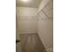 Walk-in closet features wall-mounted wire shelving at 11148 Kanturk Ct, Charlotte, NC 28213