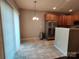 Bright dining area with stainless steel appliances and sliding glass door at 11148 Kanturk Ct, Charlotte, NC 28213