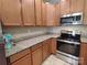 Updated kitchen with granite countertops and stainless steel appliances at 11148 Kanturk Ct, Charlotte, NC 28213