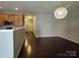 Inviting living room adjacent to the kitchen and entryway at 11148 Kanturk Ct, Charlotte, NC 28213