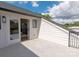 Outdoor balcony area featuring access to the interior, white walls, and tile flooring at 1119 N Myers St N Myers St, Charlotte, NC 28206