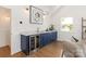 Modern bar area featuring blue cabinets, wine coolers and a wet bar at 1119 N Myers St, Charlotte, NC 28206