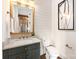 Elegant powder room boasts a custom vanity, gold hardware, and stylish shiplap walls at 1119 N Myers St, Charlotte, NC 28206