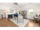 Versatile bonus room featuring a wet bar, hardwood floors, and ample natural light is ideal for entertaining at 1119 N Myers St, Charlotte, NC 28206