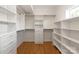 Walk-in closet with custom shelving and drawers for optimal organization at 1119 N Myers St, Charlotte, NC 28206
