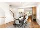 Open dining room with stairs and access to the kitchen at 1119 N Myers St, Charlotte, NC 28206
