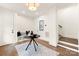 Bright foyer featuring a black accent table and wood staircase at 1119 N Myers St N Myers St, Charlotte, NC 28206