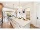 Open-concept kitchen features a large island, hardwood floors, and views of the living area at 1119 N Myers St, Charlotte, NC 28206