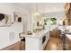 Bright kitchen featuring a large island, pendant lights, and stainless steel appliances at 1119 N Myers St, Charlotte, NC 28206