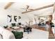 Open living room with exposed beams and access to the kitchen at 1119 N Myers St, Charlotte, NC 28206