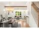 Open living room with exposed beams, fireplace, and staircase at 1119 N Myers St, Charlotte, NC 28206