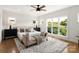 Inviting bedroom featuring natural light, a ceiling fan and a cozy rug at 1119 N Myers St, Charlotte, NC 28206