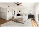 Serene bedroom featuring a comfortable bed, ceiling fan, and natural light at 1119 N Myers St, Charlotte, NC 28206
