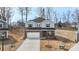 Aerial view of a new construction home, highlighting its two-story layout, two car garage, and landscaping at 117 Obadiah Ct, Troutman, NC 28115