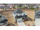 New two-story home, showing its brick and siding details and proximity to other homes in the community at 117 Obadiah Ct, Troutman, NC 28115