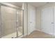 Modern bathroom with glass shower and tiled floor at 117 Obadiah Ct, Troutman, NC 28115