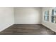Bedroom with wood floors and a double window allowing for lots of natural light at 117 Obadiah Ct, Troutman, NC 28115