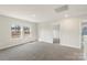 Bright, carpeted bedroom featuring two windows and neutral-colored walls at 117 Obadiah Ct, Troutman, NC 28115