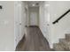 Hallway with wood floors leading to staircase and rooms at 117 Obadiah Ct, Troutman, NC 28115