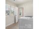 Laundry room with washer, dryer, and window with blinds at 117 Obadiah Ct, Troutman, NC 28115