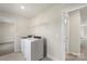 Laundry room with washer, dryer, and shelving at 117 Obadiah Ct, Troutman, NC 28115
