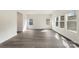 Open living room with luxury vinyl plank flooring and plenty of natural light at 117 Obadiah Ct, Troutman, NC 28115