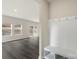 Mud room boasts coat hooks, a bench, and built-in storage space at 117 Obadiah Ct, Troutman, NC 28115