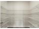 Walk-in closet boasts ample shelving for clothing and accessories at 117 Obadiah Ct, Troutman, NC 28115