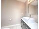Modern bathroom with a rectangular sink, sleek vanity, and neutral wall color at 11911 Maria Ester Ct, Charlotte, NC 28277