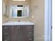 Neutral bathroom featuring vanity with rectangular mirror and modern vanity lighting at 11911 Maria Ester Ct, Charlotte, NC 28277