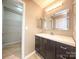 Contemporary bathroom showcasing a vanity, large mirror, and ample natural light at 11911 Maria Ester Ct, Charlotte, NC 28277