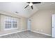 Bedroom with a large window, ceiling fan, and light wood-look flooring at 11911 Maria Ester Ct, Charlotte, NC 28277
