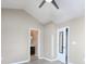 Bedroom with a vaulted ceiling, ceiling fan, en suite bathroom, and mirrored closet doors at 11911 Maria Ester Ct, Charlotte, NC 28277