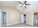 Bedroom with a vaulted ceiling, ceiling fan, en suite bathroom and walk-in closet at 11911 Maria Ester Ct, Charlotte, NC 28277