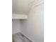 A walk-in closet with white walls offers lots of storage space at 11911 Maria Ester Ct, Charlotte, NC 28277