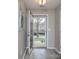 View of the front yard through the open front door, with wood-look flooring in the entryway at 11911 Maria Ester Ct, Charlotte, NC 28277